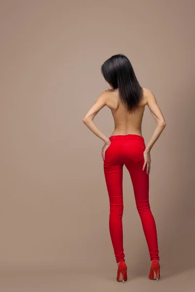 The girl in red trousers — Stock Photo, Image