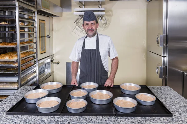 Pastry chef prepares typical hazelnut cake from Piedmont Langa Italy
