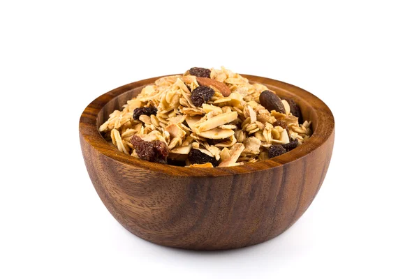 Cereais de pequeno-almoço em tigela de madeira — Fotografia de Stock