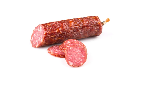 Sliced salami on white — Stock Photo, Image