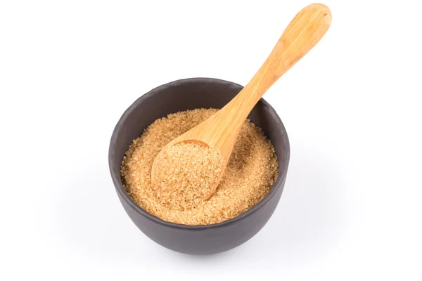 Brown sugar in a dark bowl — Stock Photo, Image