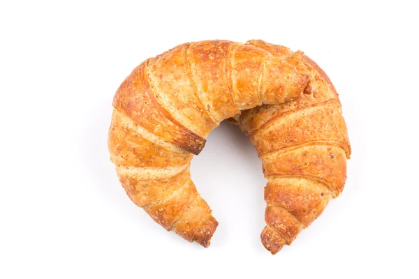 Croissant över vit bakgrund — Stockfoto