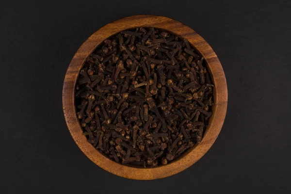 Clove spice in wooden bowl — Stock Photo, Image