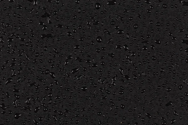 Water drops on dark stone surface — Stock Photo, Image