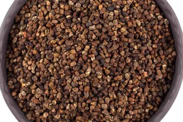 Sementes de cardamomo decorticadas em uma tigela — Fotografia de Stock