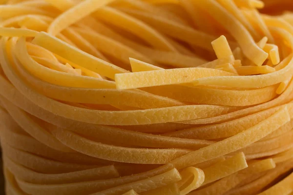 Dried Italian Pasta Fettuccine Nests Abstract Food Background Closeup Shot — Stock Photo, Image