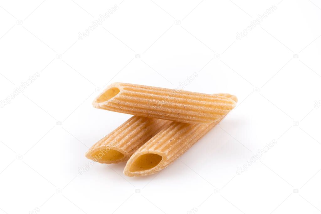 Wholemeal Pasta Penne as close-up shot isolated on white background