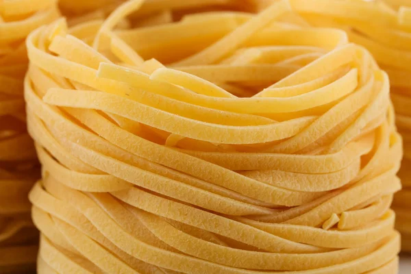 Pasta Italiana Seca Nidos Fettuccine Fondo Abstracto Comida Primer Plano — Foto de Stock