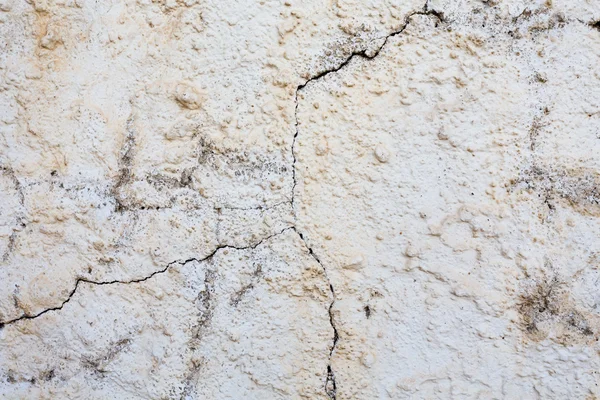 Cracked stone wall background — Stock Photo, Image