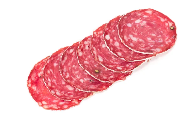 Slices of salami sausage on a white background — Stock Photo, Image