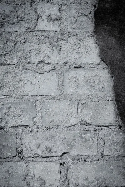 Pared de ladrillo con yeso agrietado - textura — Foto de Stock