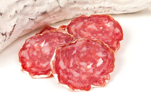 Pile of red salami, on a white — Stock Photo, Image