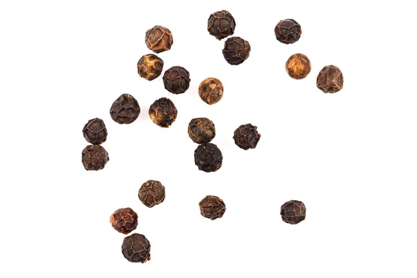 Black pepper seeds on white — Stock Photo, Image