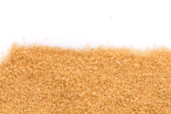 Cristalli zucchero di canna isolato su bianco — Foto Stock