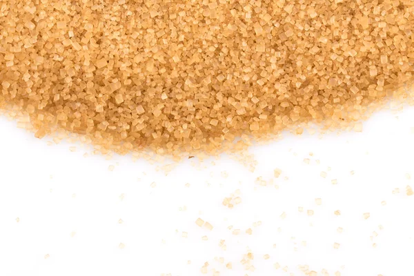 Kryształy cukru trzcinowego na białym tle — Zdjęcie stockowe