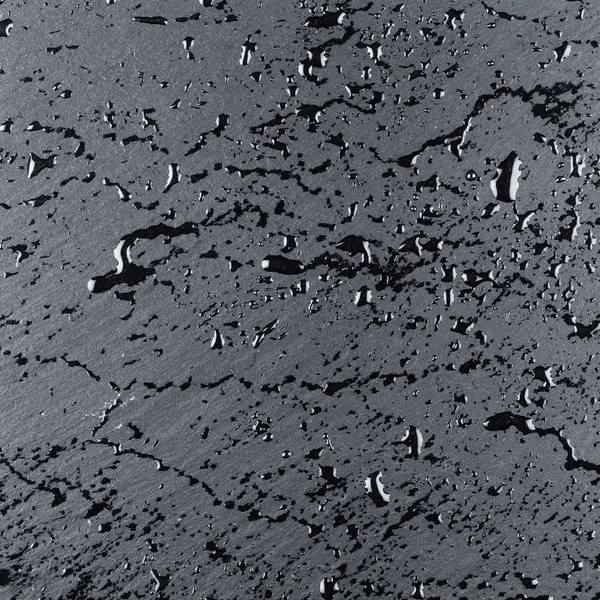 Voda na temný kámen povrchu — Stock fotografie