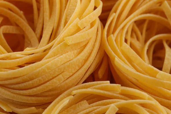 Pastas italianas secas, nidos de Fettuccine —  Fotos de Stock