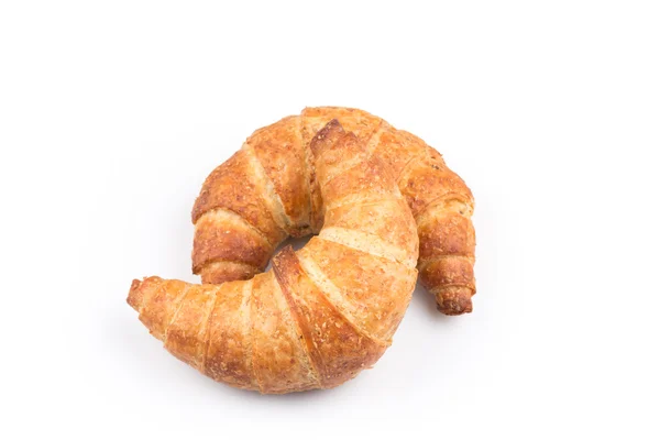 Croissant över vit bakgrund — Stockfoto