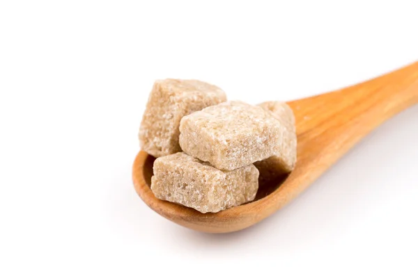 Brązowy cukier w drewnianą łyżką — Zdjęcie stockowe