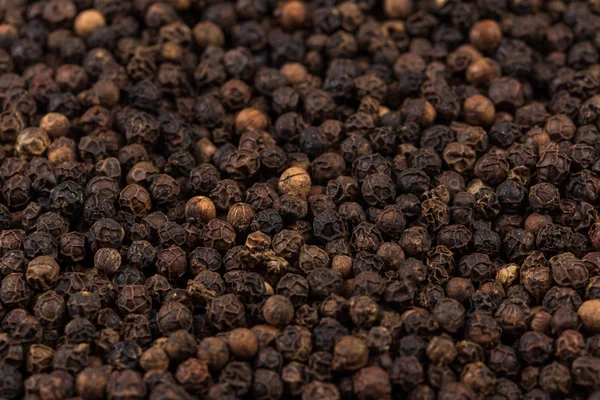 Black pepper zoomed in on — Stok fotoğraf