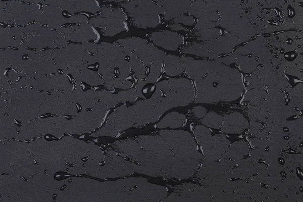 A sötét kő felszíni víz — Stock Fotó