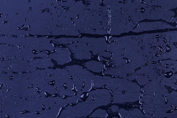 水蓝色深色石材表面上 — 图库照片