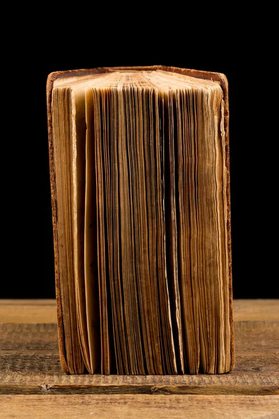 Ancient book shot on black background — Stock Photo, Image