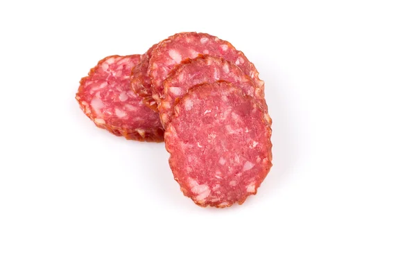 Sliced salami on white — Stock Photo, Image