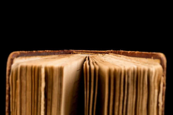 Ancient book shot on black background — Stock Photo, Image