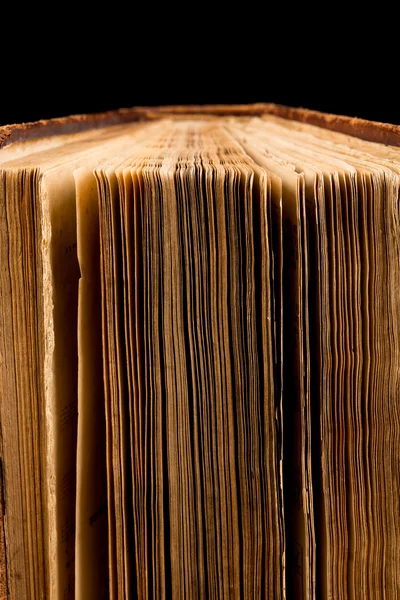 Ancient book shot on black background — Stock Photo, Image