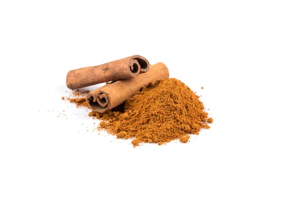 Cinnamon sticks with powder — Stock Photo, Image