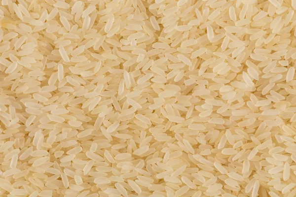 Uncooked rice background — Stock Photo, Image