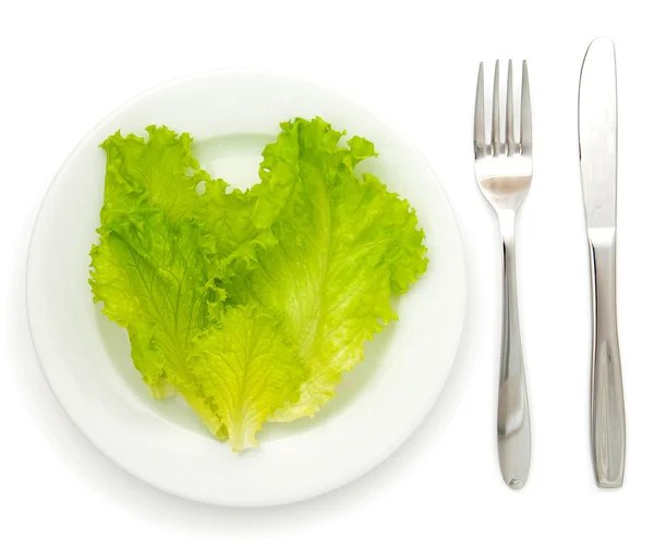 Saláta egy fehér lemezre kés és Villa — Stock Fotó