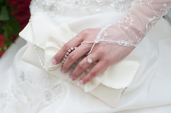 Wedding handbag in her hand the bride — Stock Photo, Image
