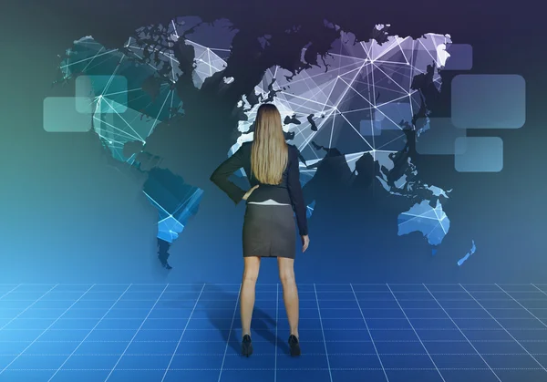 Girl stands in front of the network world map