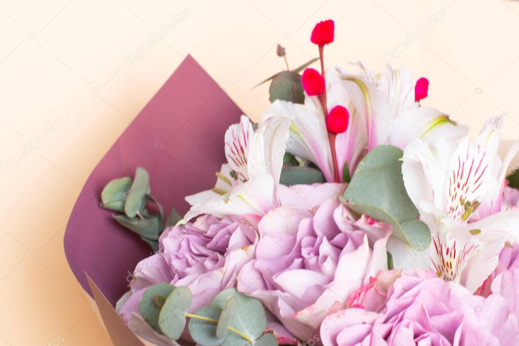 bouquet of Alstroemeria and purple roses. Fresh, lush bouquet of colorful flowers