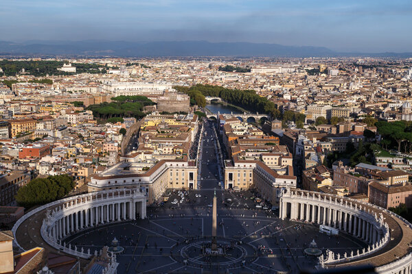 ROME, ITALY - SEPTEMBER 23, 2015 : Top view of Vatican City from the dome of St. Peter's Basilica in Italy, on cloudy sky background.