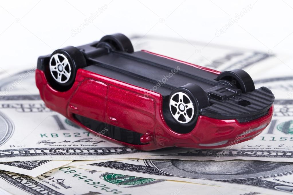 Dollar Banknotes and Toy Car Accident