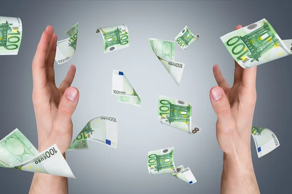 Euro Banknotes Falling on Young Male Hands — Stock Photo, Image