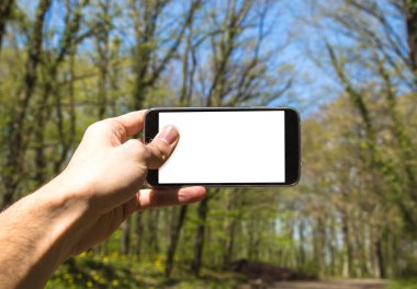 El ele tutuşan cep telefonu
