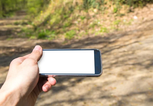 Hand houden van mobiele telefoon — Stockfoto