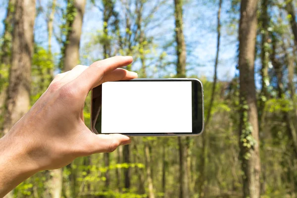 Inteligentny telefon trzyma pod ręką — Zdjęcie stockowe