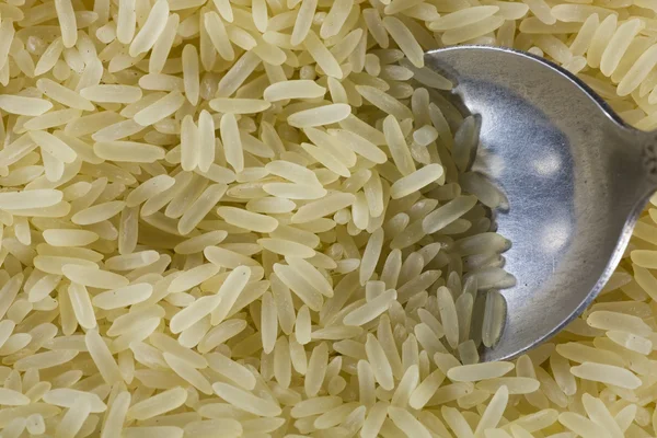 Grãos de arroz branco e amarelo close-up — Fotografia de Stock