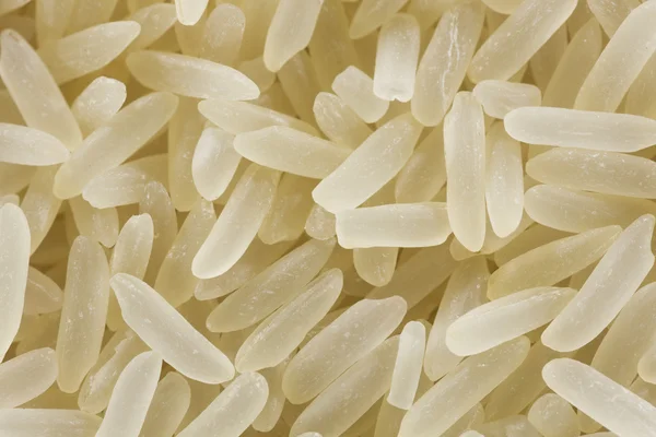 Grãos de arroz branco e amarelo close-up — Fotografia de Stock