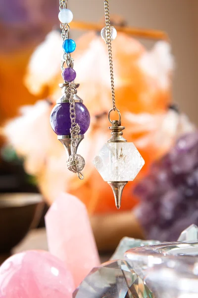 Pendulum and crystals — Stock Photo, Image