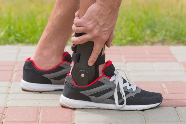 Man wearing ankle brace — Stock Photo, Image