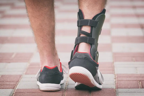 Man wearing ankle brace — Stock Photo, Image