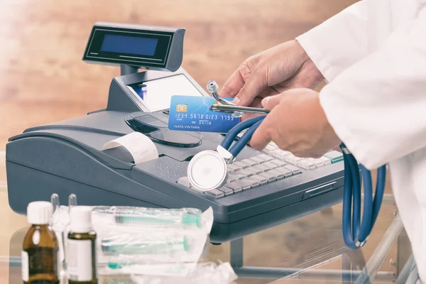 Pharmacist or medical doctor using cash register — Stock Photo, Image