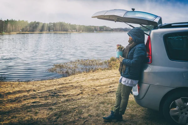 Woman Eating Hot Dish Thermos Hike Leaning Car Lake Forest — Stock Photo, Image