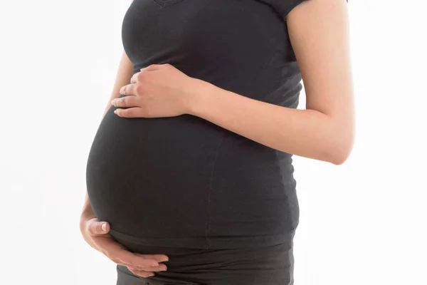 Mulher Grávida Fundo Branco Está Segurando Uma Barriga — Fotografia de Stock